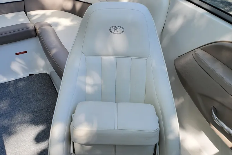 Slide: The Image of 2006 Cobalt 246 boat interior with white leather seating and logo detail. - 31