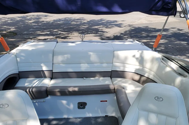 Slide: The Image of Interior of a 2006 Cobalt 246 boat with white and gray seating. - 36