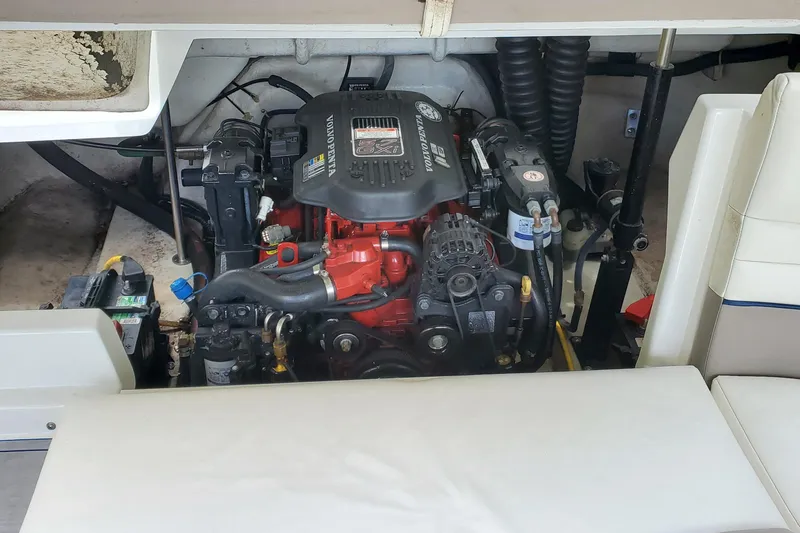 Slide: The Image of Engine compartment of a 2006 Cobalt 246 boat, featuring a Volvo Penta engine. - 49