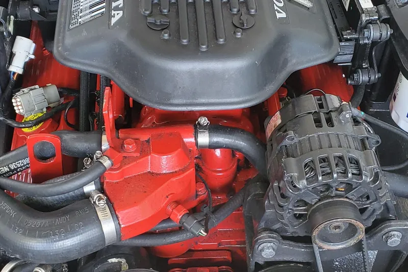 Slide: The Image of 2006 Cobalt 246 engine close-up, featuring red components and visible alternator. - 51