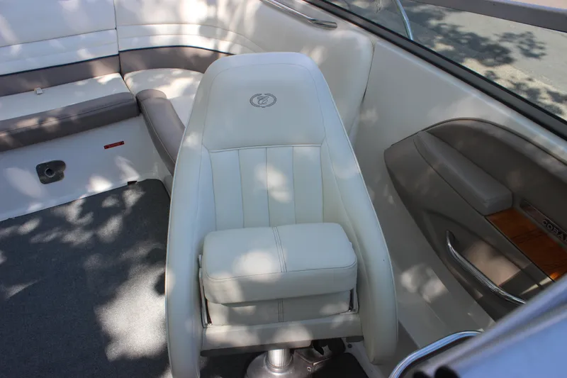 Slide: The Image of Interior of 2006 Cobalt 246 boat with white seating and wood accents. - 6