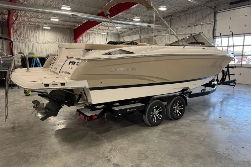 Slide: The Image of 2012 Regal 2700 Bowrider boat on trailer in indoor storage facility. - 4