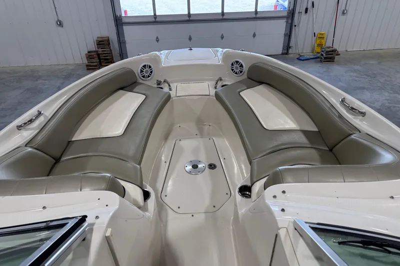 Slide: The Image of 2005 Sea Ray 240 Sundeck interior with spacious seating and modern design. - 10
