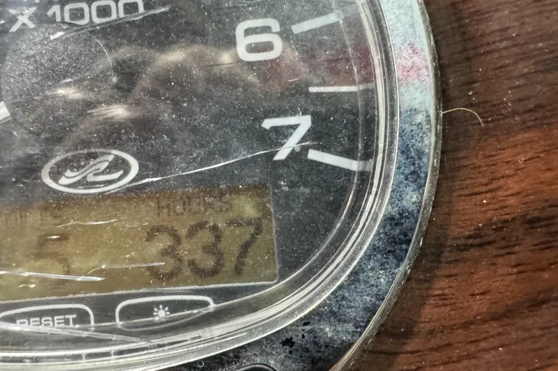 Slide: The Image of Close-up of a 2005 Sea Ray 240 Sundeck tachometer displaying 337 hours. - 12