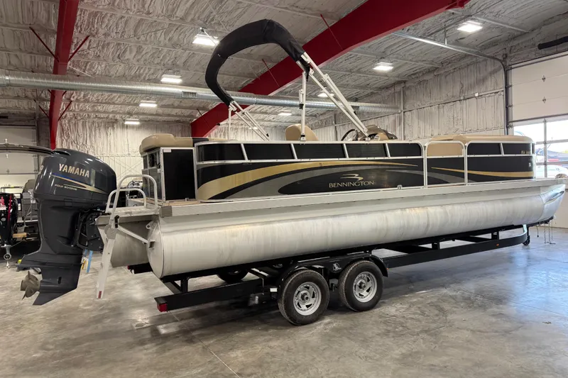 Slide: The Image of 2010 Bennington 2574GLi pontoon boat with Yamaha engine in indoor storage. - 3