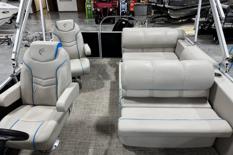 Slide: The Image of 2017 Cypress Cay Seabreeze 253 boat interior with plush seating and modern design. - 10