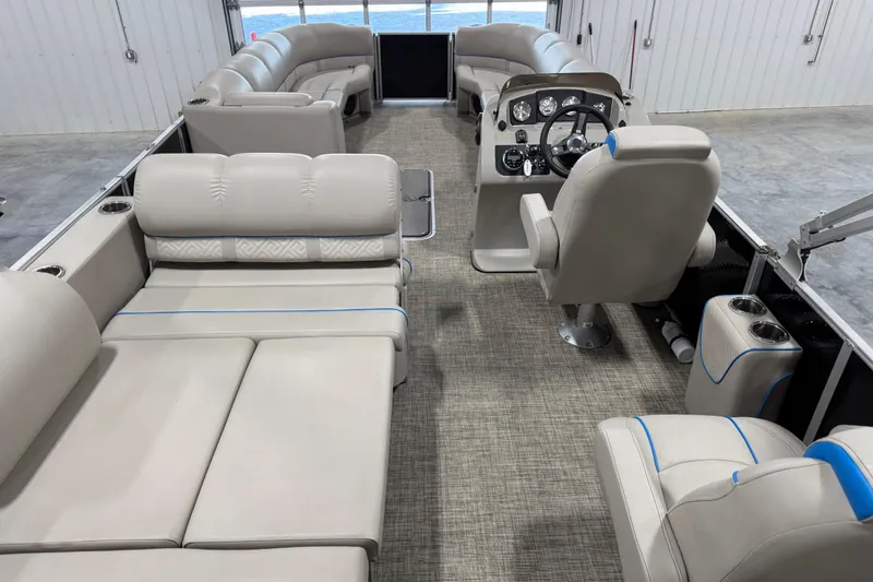 Slide: The Image of 2017 Cypress Cay Seabreeze 253 pontoon boat interior with plush seating and modern helm. - 13
