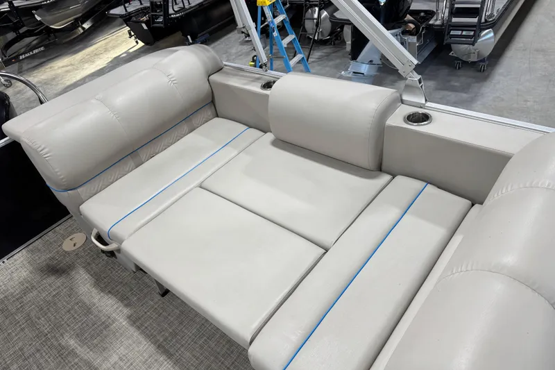 Slide: The Image of 2017 Cypress Cay Seabreeze 253 boat interior with plush seating and cup holders. - 14