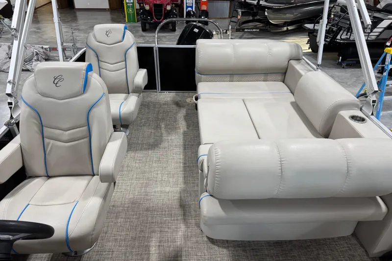 Slide: The Image of 2017 Cypress Cay Seabreeze 253 boat interior with plush seating and modern design. - 15