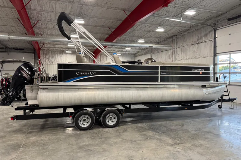 Slide: The Image of 2017 Cypress Cay Seabreeze 253 pontoon boat on trailer in indoor storage. - 3