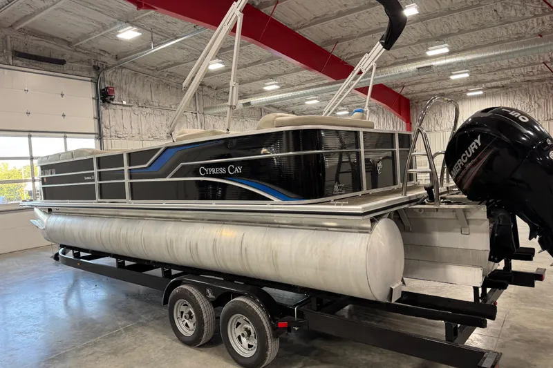 Slide: The Image of 2017 Cypress Cay Seabreeze 253 pontoon boat on trailer in indoor storage. - 4