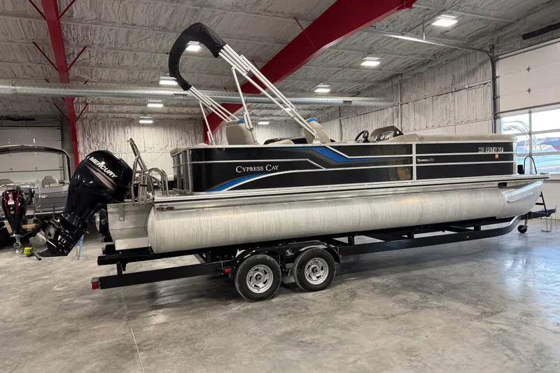Slide: The Image of 2017 Cypress Cay Seabreeze 253 pontoon boat in a spacious indoor storage facility. - 7
