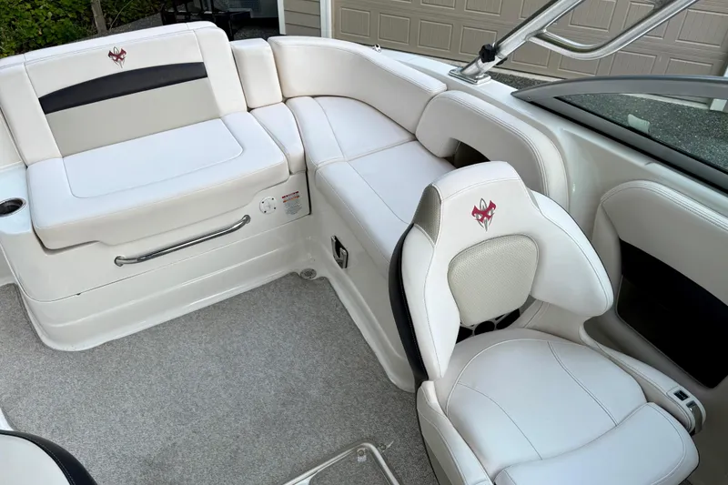 Slide: The Image of 2009 Chaparral Sunesta 224 Xtreme boat interior with white seating and modern design. - 22