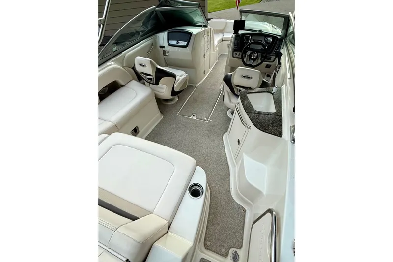 Slide: The Image of 2009 Chaparral Sunesta 224 Xtreme boat interior with seating and helm, featuring modern design. - 30