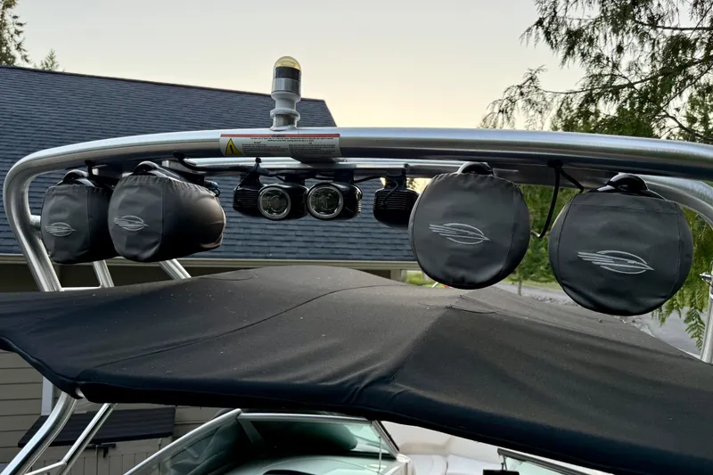 Slide: The Image of 2009 Chaparral Sunesta 224 Xtreme boat with speakers and lights on the wakeboard tower. - 34