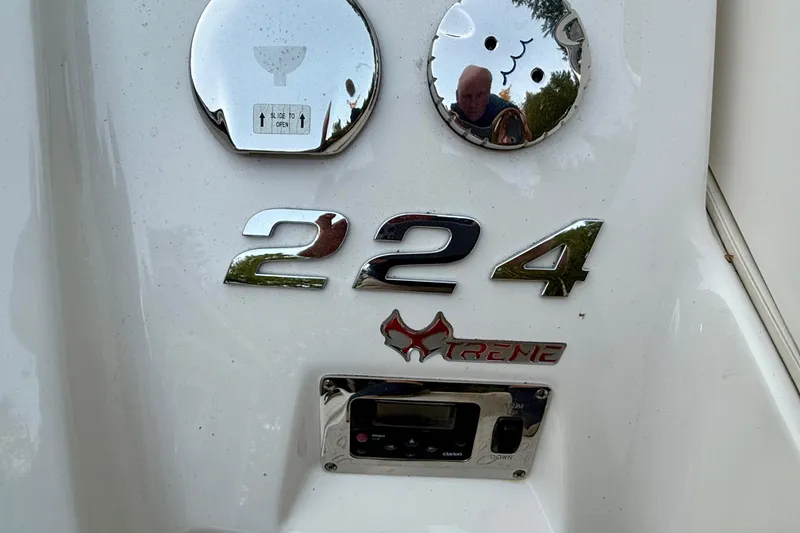 Slide: The Image of 2009 Chaparral Sunesta 224 Xtreme boat emblem and control panel. - 35
