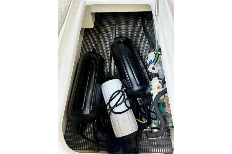 Slide: The Image of Storage compartment of 2009 Chaparral Sunesta 224 Xtreme with boat fenders and equipment. - 39