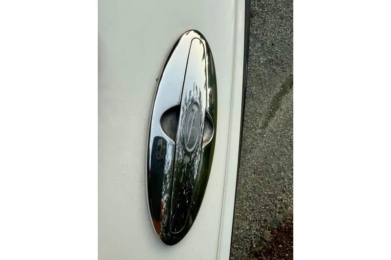 Slide: The Image of Chrome oval detail on 2009 Chaparral Sunesta 224 Xtreme boat. - 40