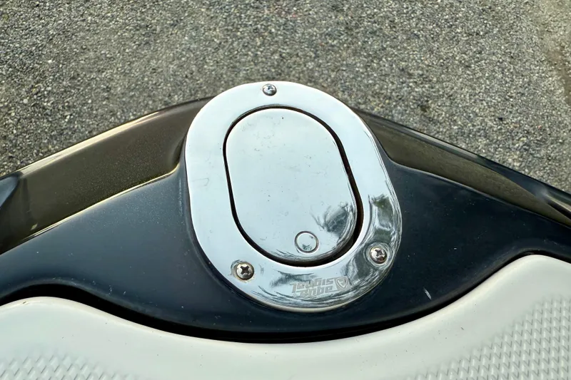Slide: The Image of Fuel cap of 2009 Chaparral Sunesta 224 Xtreme boat on textured surface. - 42