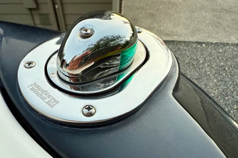 Slide: The Image of 2009 Chaparral Sunesta 224 Xtreme boat navigation light, chrome finish, close-up view. - 43