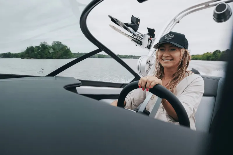 Slide: The Image of 2026 MasterCraft XT20 boat with sleek seating and wood accents. - 4