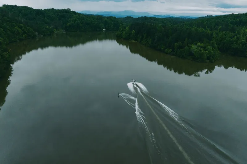 Slide: The Image of Interior view of 2026 MasterCraft XT20 boat at a trade show. - 6