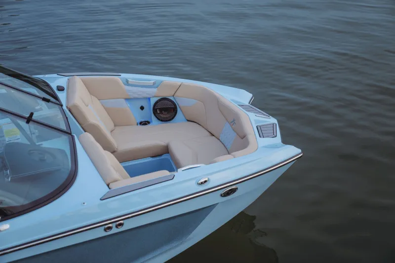 Slide: The Image of MasterCraft XT20 2026 boat storage compartment with net cover. - 8