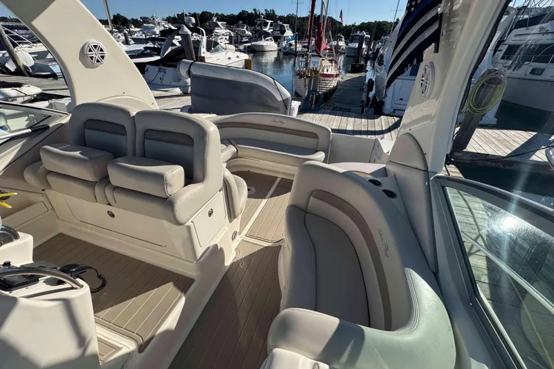 Slide: The Image of Luxurious interior of 2002 Sea Ray 320 Sundancer yacht docked at marina. - 14