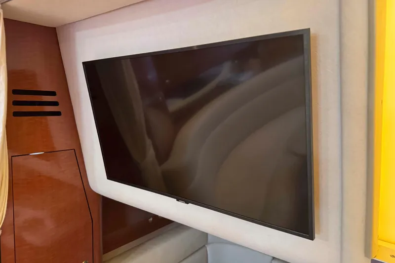 Slide: The Image of Flat-screen TV inside 2002 Sea Ray 320 Sundancer yacht cabin. - 22