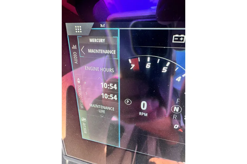 Slide: The Image of Dashboard display of 2024 Fountain 34 Thundercat showing engine hours and RPM gauge. - 17