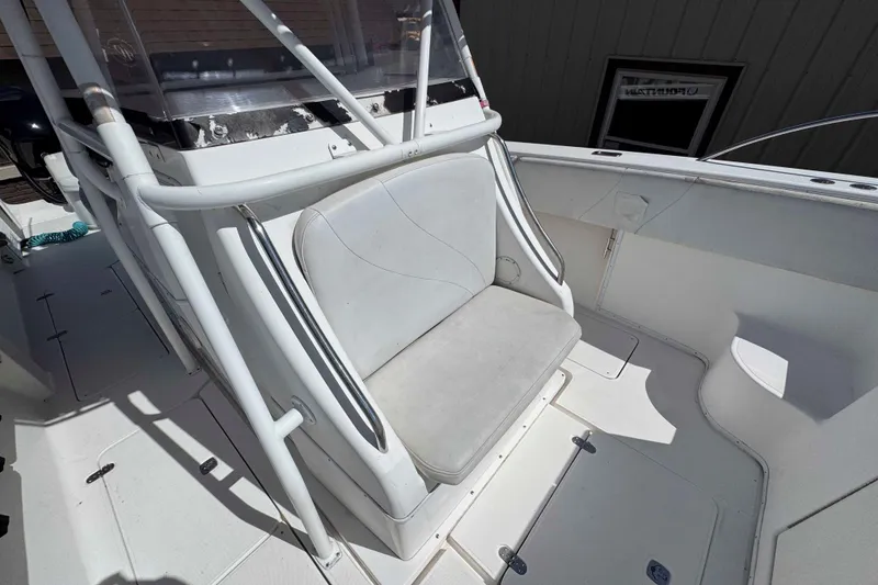 Slide: The Image of 2008 Fountain 38 Tournament Edition boat interior with seating and console. - 11