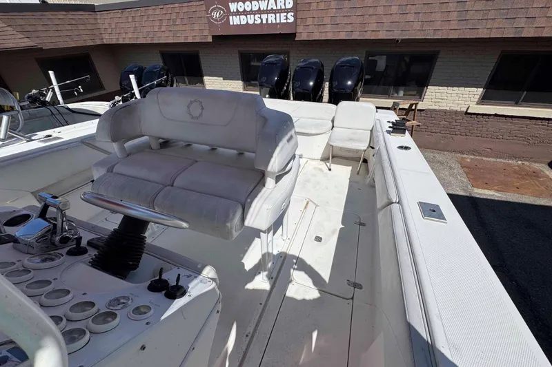 Slide: The Image of 2008 Fountain 38 Tournament Edition boat with seating and controls, parked at Woodward Industries. - 13