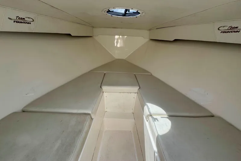 Slide: The Image of 2008 Fountain 38 Tournament Edition boat interior with cushioned seating and hatch. - 17