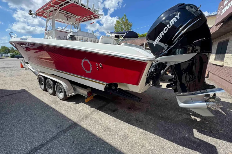 Slide: The Image of 2008 Fountain 38 Tournament Edition boat with Mercury Verado engines, red and white design. - 4