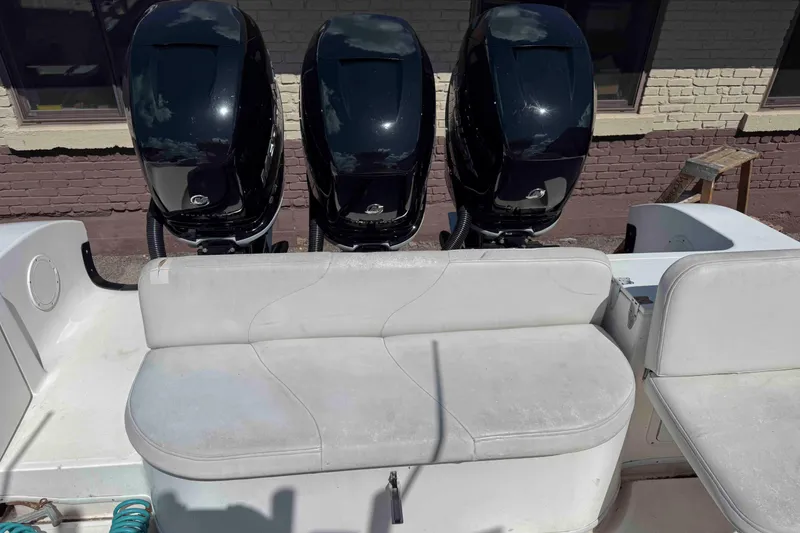 Slide: The Image of 2008 Fountain 38 Tournament Edition boat with triple outboard engines and white seating. - 7