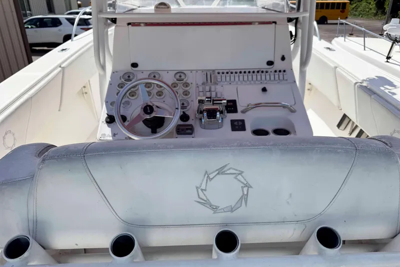 Slide: The Image of 2008 Fountain 38 Tournament Edition boat cockpit with steering wheel and control panel. - 8