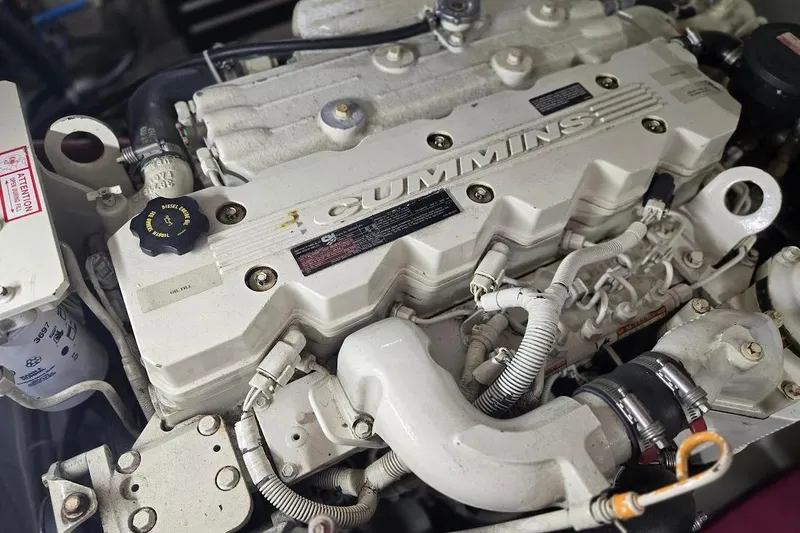 Slide: The Image of Engine of a 2005 American Tug 34 Pilothouse, featuring a Cummins diesel engine. - 10