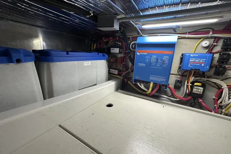 Slide: The Image of Electrical system in 2005 American Tug 34 Pilothouse, featuring Victron Energy components and organized wiring. - 103