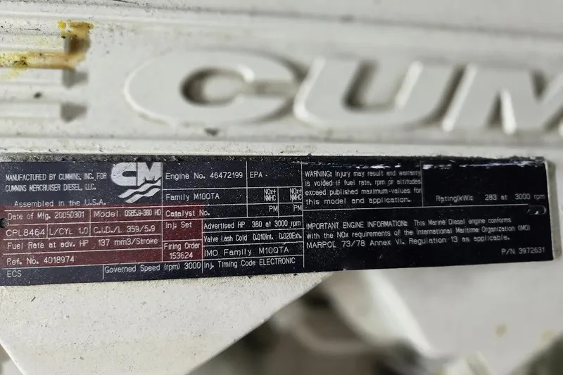 Slide: The Image of Engine label of a 2005 American Tug 34 Pilothouse, Cummins Marine Diesel specifications. - 105