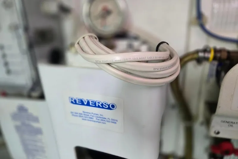 Slide: The Image of Reverso pump system in a 2005 American Tug 34 Pilothouse engine room. - 110