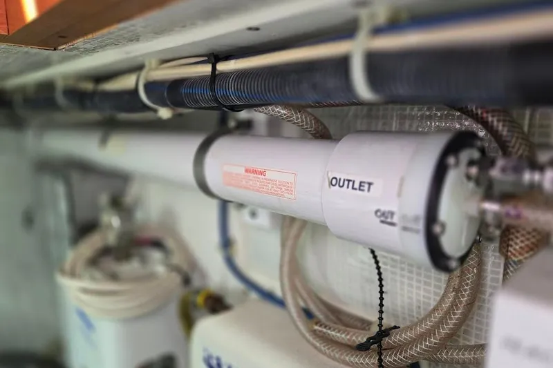 Slide: The Image of Engine room piping in a 2005 American Tug 34 Pilothouse boat. - 113