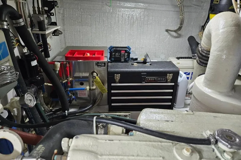 Slide: The Image of Engine room of 2005 American Tug 34 Pilothouse with tools and equipment. - 115