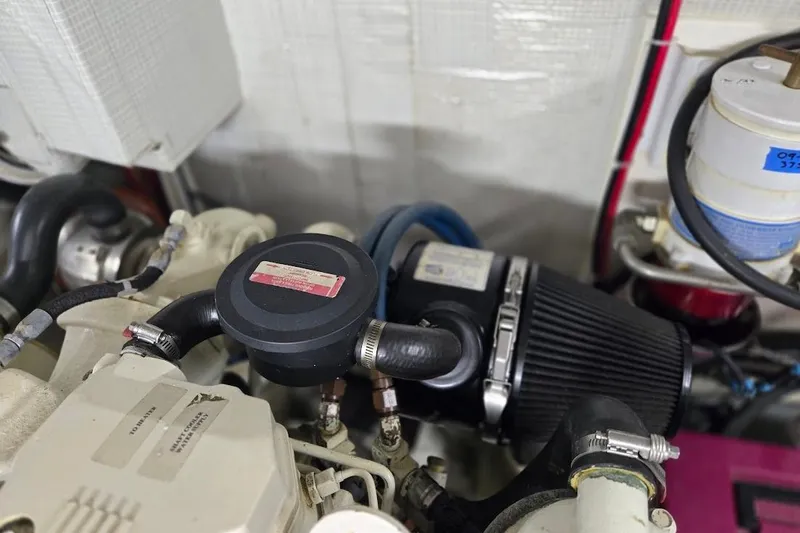 Slide: The Image of Engine compartment of a 2005 American Tug 34 Pilothouse, showcasing mechanical components. - 116