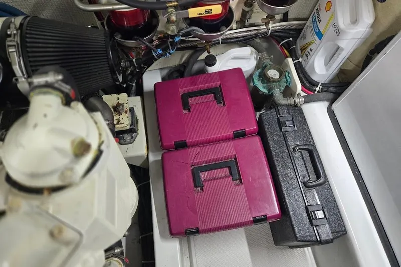 Slide: The Image of Engine room of a 2005 American Tug 34 Pilothouse with toolboxes and maintenance supplies. - 117