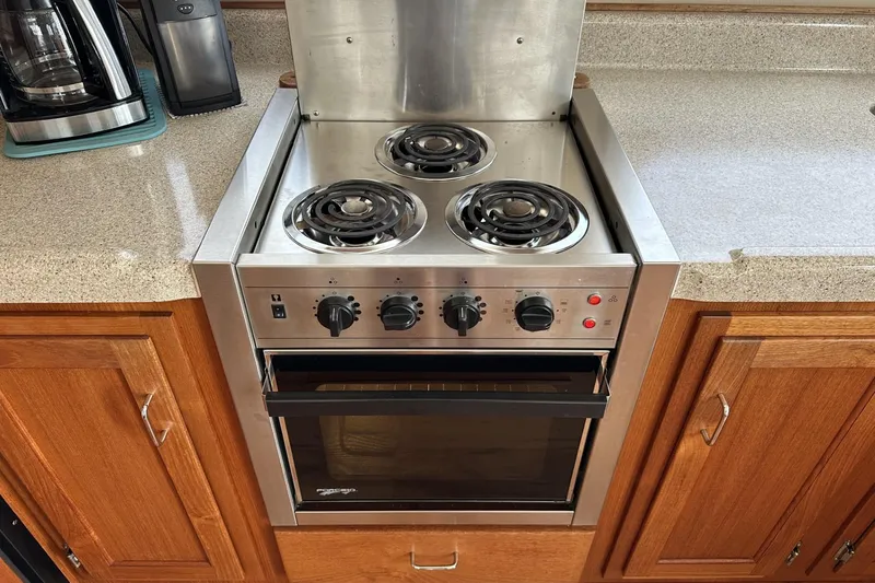 Slide: The Image of Stainless steel stove and oven in 2005 American Tug 34 Pilothouse kitchen. - 23