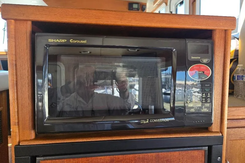 Slide: The Image of Sharp Carousel microwave in 2005 American Tug 34 Pilothouse kitchen. - 26