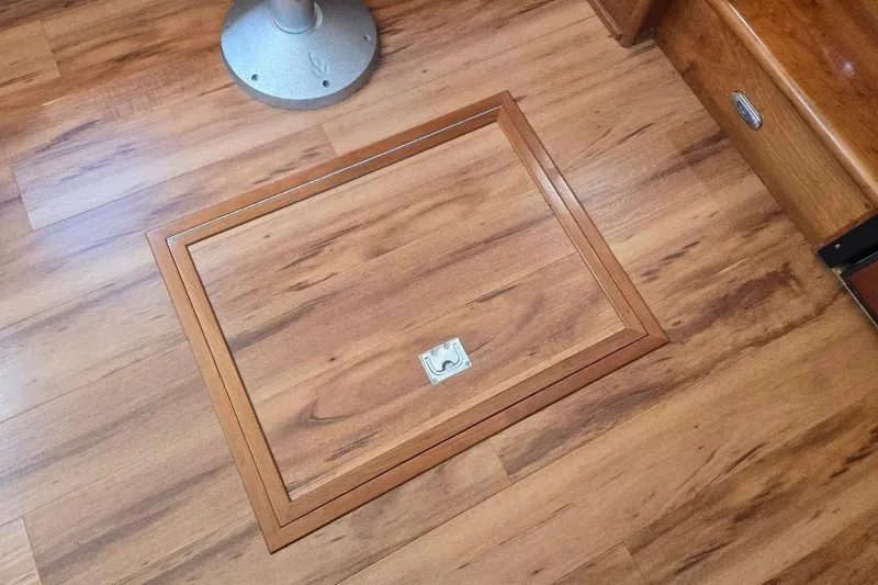 Slide: The Image of Wooden floor hatch on 2005 American Tug 34 Pilothouse boat interior. - 4