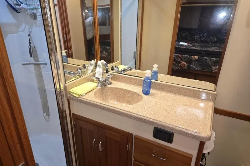 Slide: The Image of Bathroom interior of 2005 American Tug 34 Pilothouse with sink, mirror, and shower. - 40