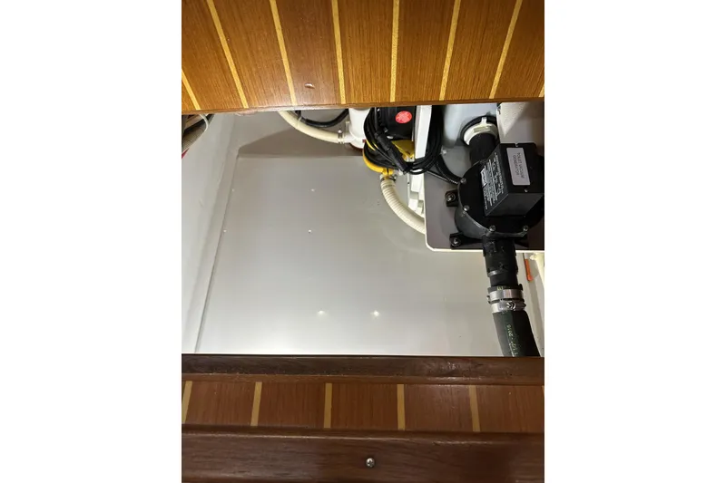 Slide: The Image of Engine compartment of 2005 American Tug 34 Pilothouse with visible wiring and components. - 44