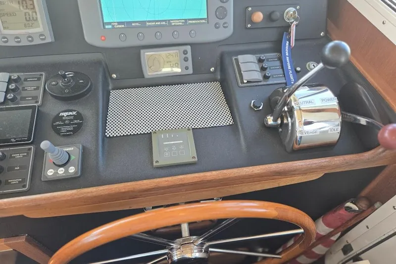 Slide: The Image of Control panel of a 2005 American Tug 34 Pilothouse with navigation instruments. - 51